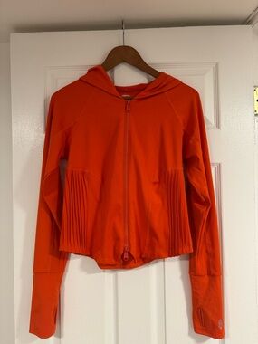 FP Movement Bright Orange Zip Hoodie with Pleated Side Panels
